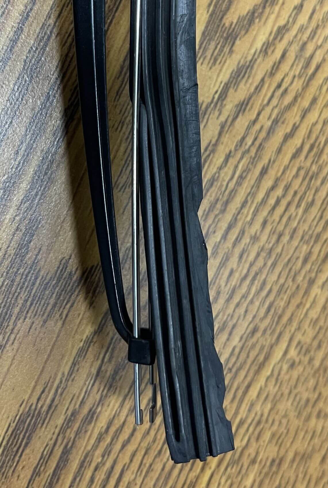 Fall car maintenance checklist: worn wiper blade separating from its frame, found during an inspection at Carz R Us in Machesney Park IL